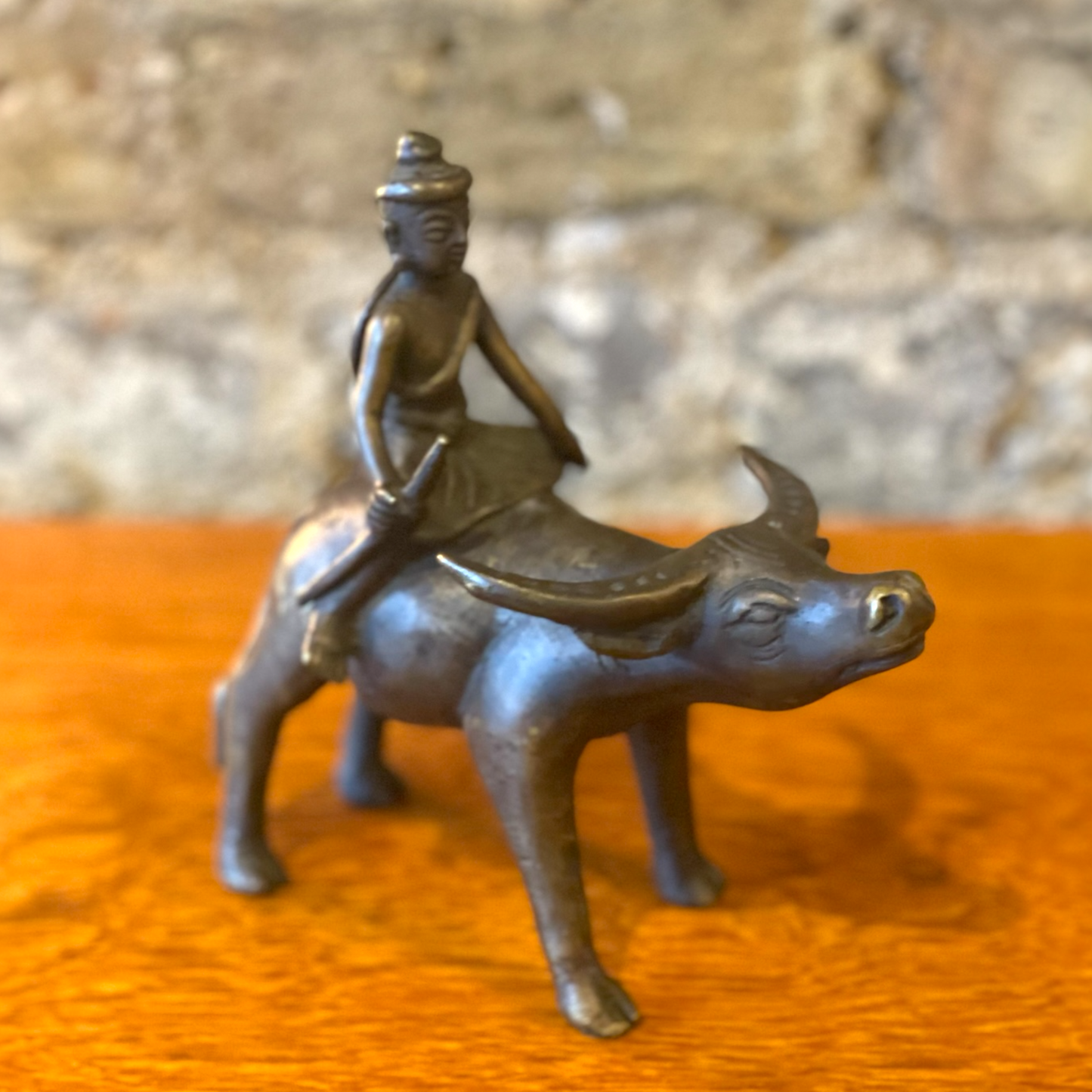 Bronze Sculpture 0f a Buffalo and Boy